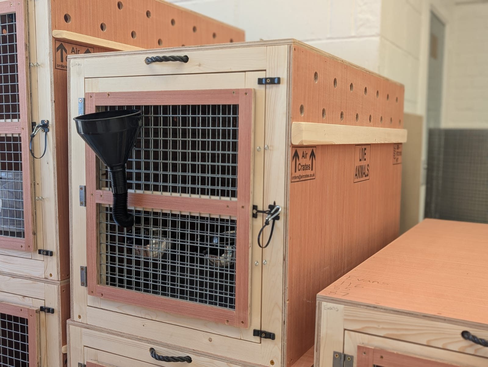 Close detail of treated timber, ventilation slots and metal fixings on an Air Crates build