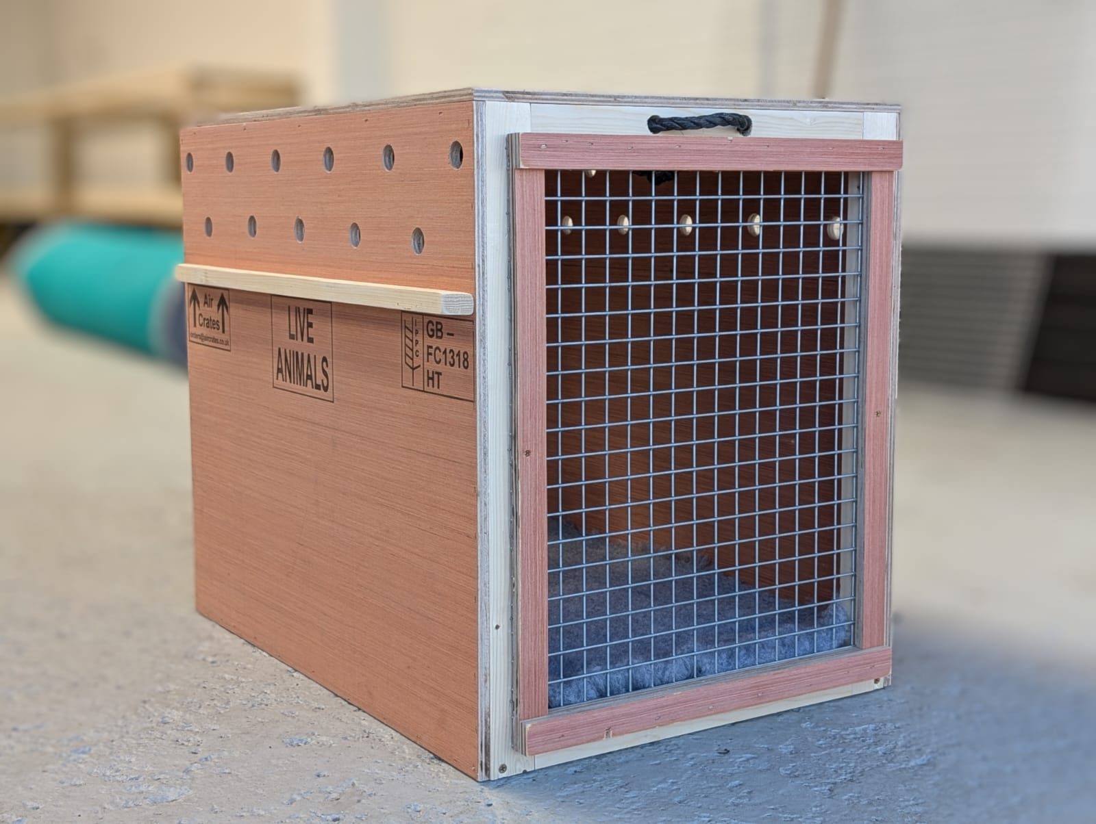 A finished Air Crates wooden pet travel crate in the workshop
